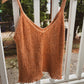 knitted tank top in orange/brown boucle yarn with a picot hem.