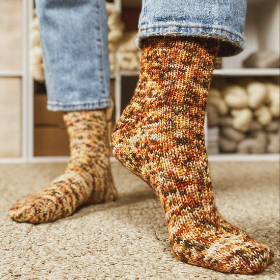 two-at-a-time, toe-up sock formula knitting pattern in variegated wool